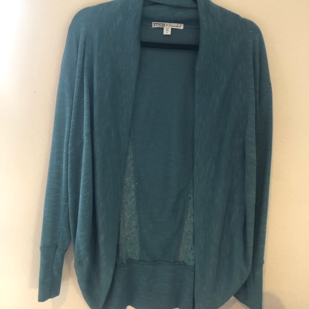Gypsies and moon dust brand cardigan with lace detail on the back in a size M.